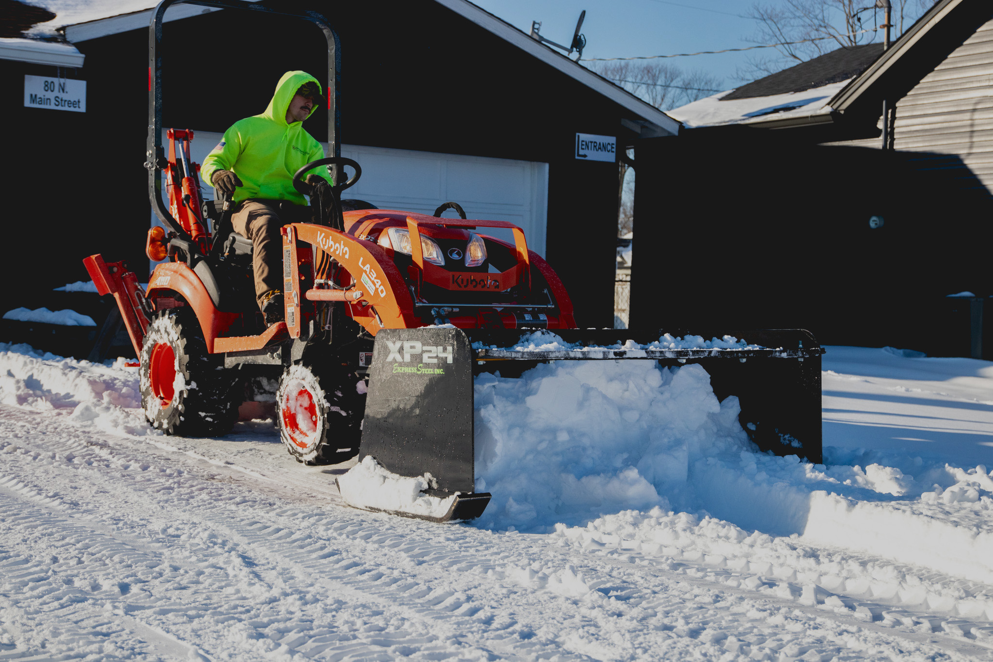 ES Attachments heavy-duty skid steer attachment in use on a jobsite.