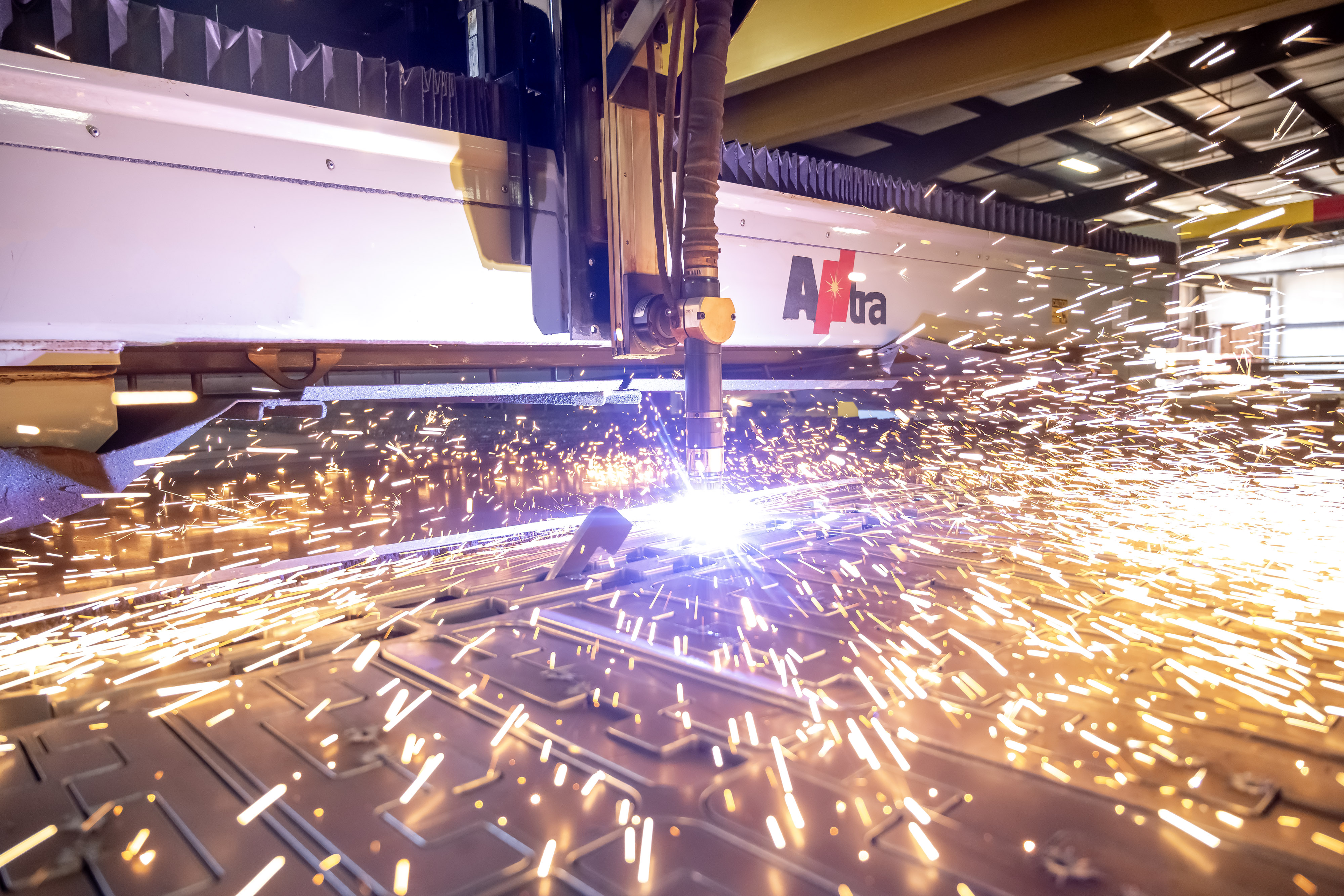 Sheets of steel being cut to size